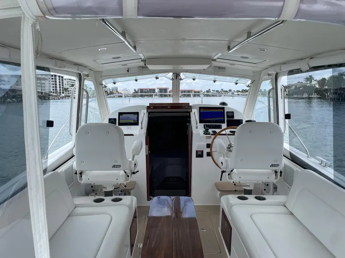  Yacht Photos Pics 2023 MJM 35z boat interior with helm, seating, and navigation equipment.
