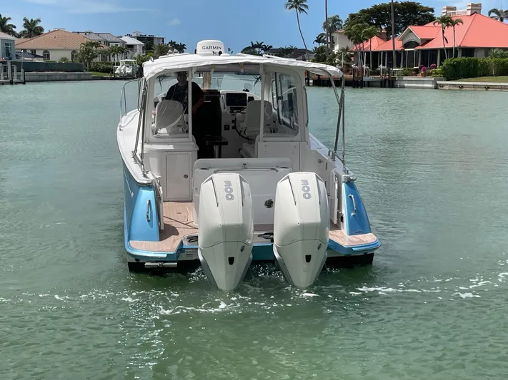  Yacht Photos Pics 2023 MJM 35z boat with dual engines cruising in a scenic canal.
