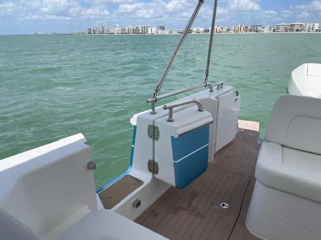  Yacht Photos Pics 2023 MJM 35z boat deck with ocean view and city skyline in background.