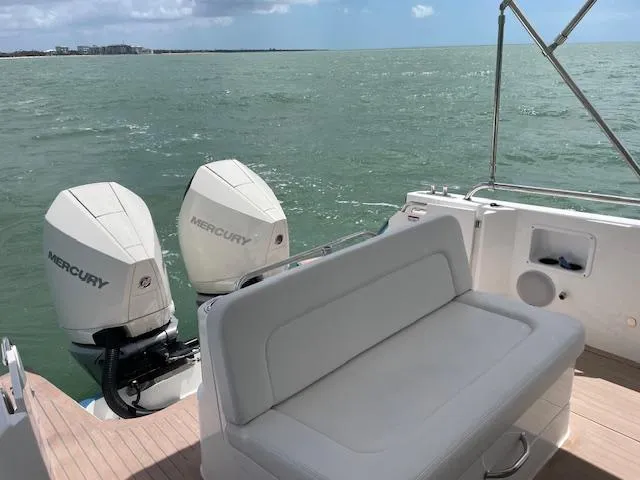  Yacht Photos Pics 2023 MJM 35z boat with twin Mercury outboard engines on open water.