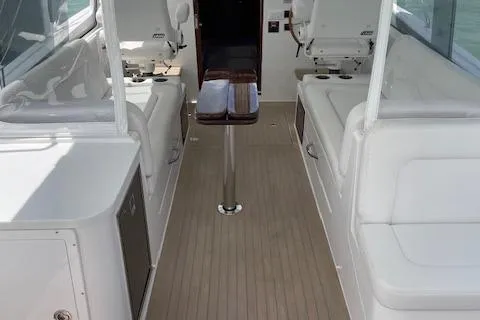  Yacht Photos Pics 2023 MJM 35z boat interior with white seating and wooden flooring.