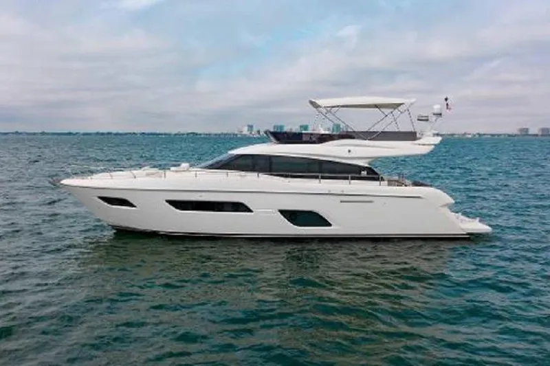  Yacht Photos Pics 2022 Ferretti Yachts 550 cruising on open water under a cloudy sky.