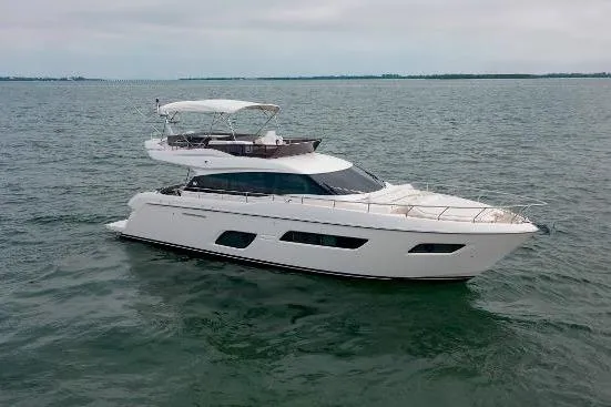  Yacht Photos Pics 2022 Ferretti Yachts 550 cruising on open water, showcasing sleek design and luxury features.
