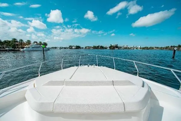 Yacht Photos Pics Ferretti Yachts 550, 2022 model, cruising on a sunny day with clear blue skies.