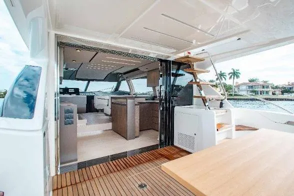  Yacht Photos Pics Luxurious 2022 Ferretti Yachts 550 interior with modern design and spacious deck area.