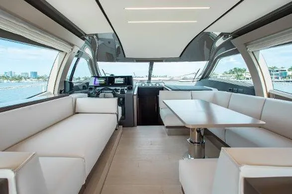  Yacht Photos Pics Luxurious interior of 2022 Ferretti Yachts 550 with modern seating and navigation area.