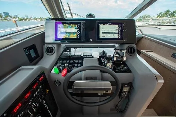  Yacht Photos Pics Helm of 2022 Ferretti Yachts 550 with advanced navigation displays and controls.