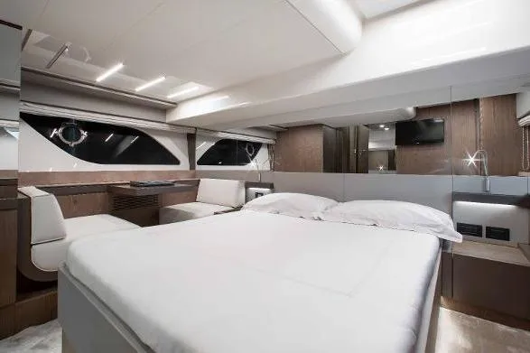  Yacht Photos Pics Luxurious interior of 2022 Ferretti Yachts 550, featuring a spacious bedroom with modern design.