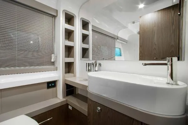  Yacht Photos Pics Luxurious bathroom interior of 2022 Ferretti Yachts 550 with modern fixtures and elegant design.