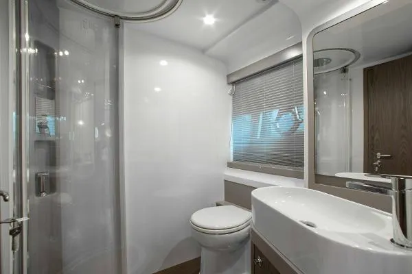  Yacht Photos Pics Luxurious bathroom in 2022 Ferretti Yachts 550, featuring modern fixtures and sleek design.