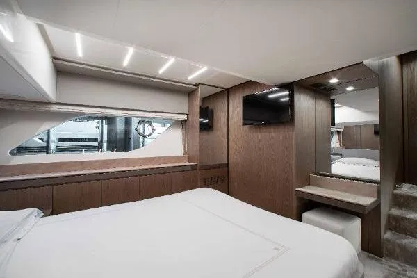  Yacht Photos Pics Luxurious interior of 2022 Ferretti Yachts 550, featuring elegant wood paneling and modern amenities.