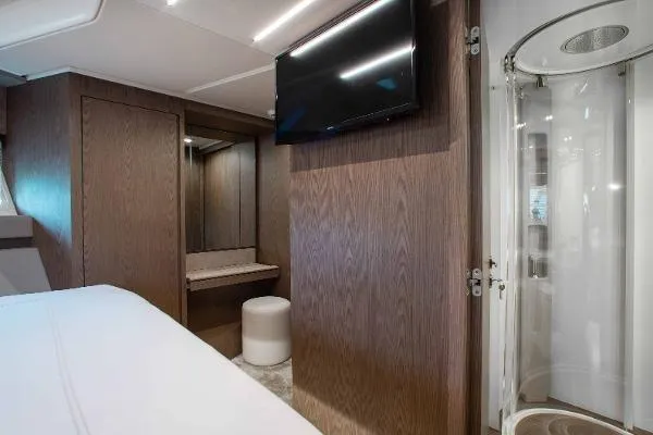  Yacht Photos Pics Luxurious interior of 2022 Ferretti Yachts 550 with modern amenities and elegant wood finishes.