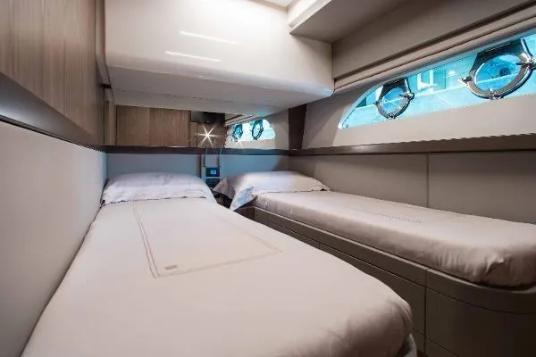  Yacht Photos Pics Luxurious twin cabin interior of 2022 Ferretti Yachts 550 with modern design.