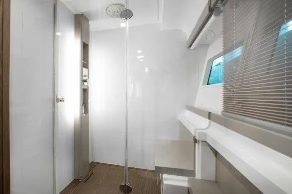  Yacht Photos Pics Modern bathroom interior on 2022 Ferretti Yachts 550, featuring sleek design and shower.