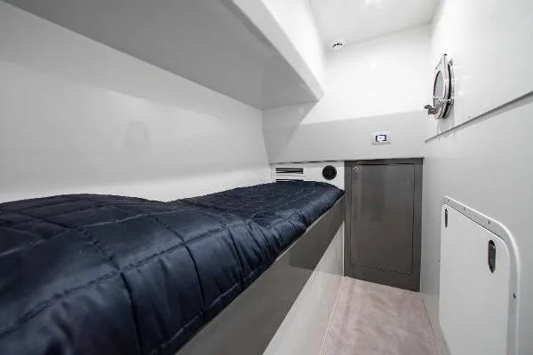  Yacht Photos Pics 2022 Ferretti Yachts 550 interior cabin with sleek design and comfortable bedding.