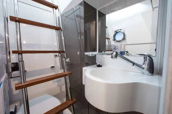  Yacht Photos Pics Modern bathroom interior on 2022 Ferretti Yachts 550, featuring sleek design and wooden accents.