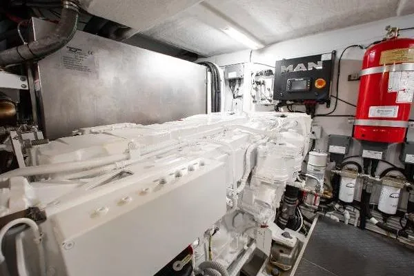  Yacht Photos Pics Engine room of 2022 Ferretti Yachts 550, featuring MAN engine and safety equipment.