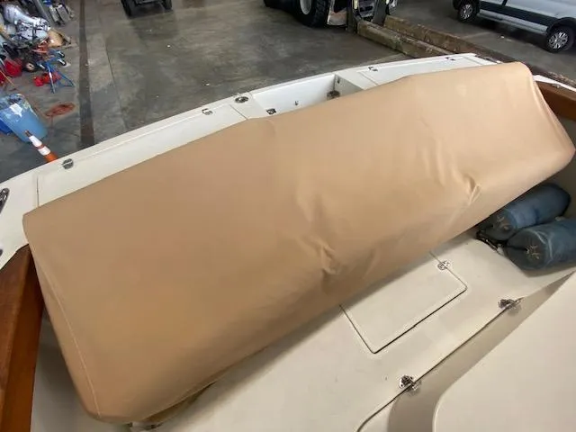  Yacht Photos Pics 2009 Hunt Yachts Harrier 29 with tan seat cover in a garage setting.