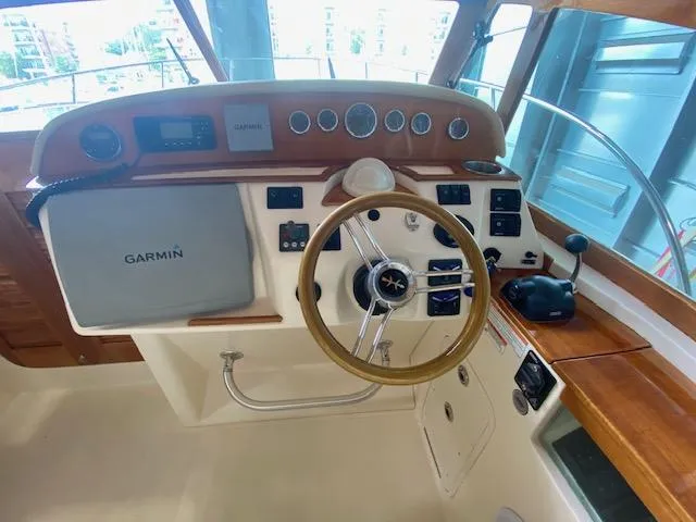  Yacht Photos Pics 2009 Hunt Yachts Harrier 29 helm with Garmin navigation and wooden steering wheel.