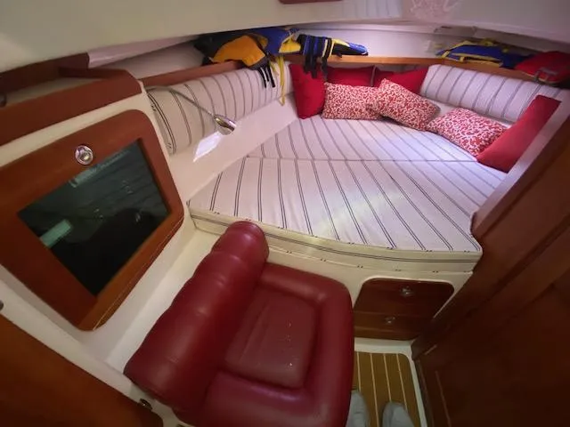  Yacht Photos Pics 2009 Hunt Yachts Harrier 29 cabin with striped bedding and red accents.