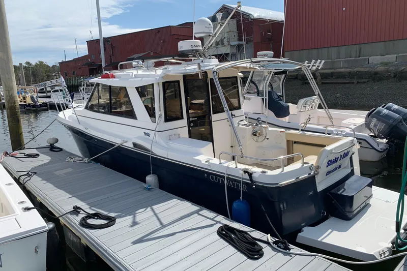 Shake N Bake Yacht Photos Pics 2013 Cutwater 28 LE boat docked at marina, featuring sleek design and modern equipment.