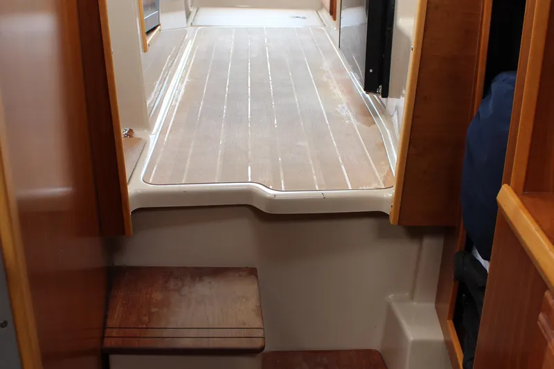 Shake N Bake Yacht Photos Pics Interior view of 2013 Cutwater 28 LE boat with wooden flooring and steps.
