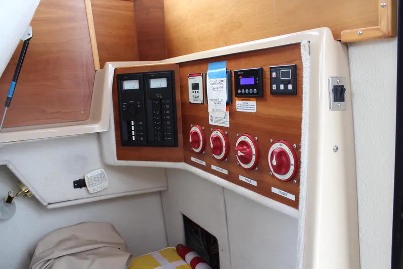 Shake N Bake Yacht Photos Pics Control panel of a 2013 Cutwater 28 LE boat with switches and gauges.