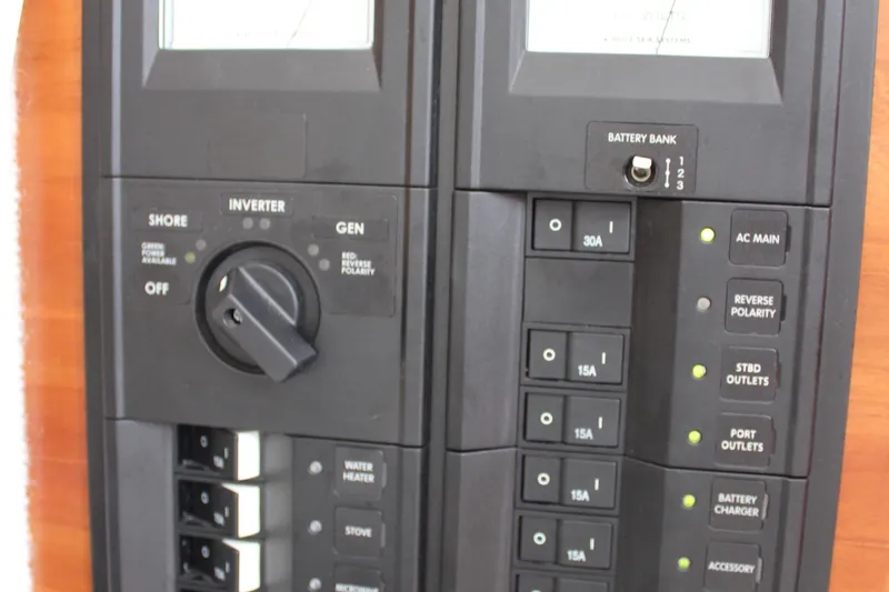 Shake N Bake Yacht Photos Pics Electrical control panel on a 2013 Cutwater 28 LE boat, featuring switches and indicators.