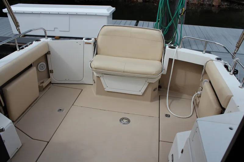 Shake N Bake Yacht Photos Pics 2013 Cutwater 28 LE boat interior with beige seating and deck.