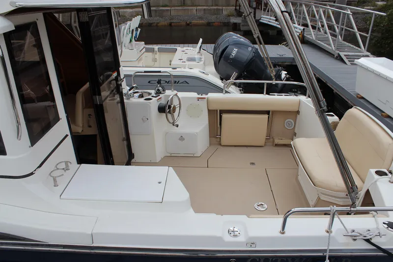Shake N Bake Yacht Photos Pics 2013 Cutwater 28 LE boat interior with seating and steering area.