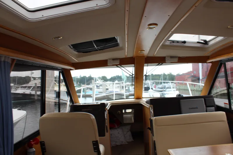 Shake N Bake Yacht Photos Pics Interior view of 2013 Cutwater 28 LE boat with marina in background.