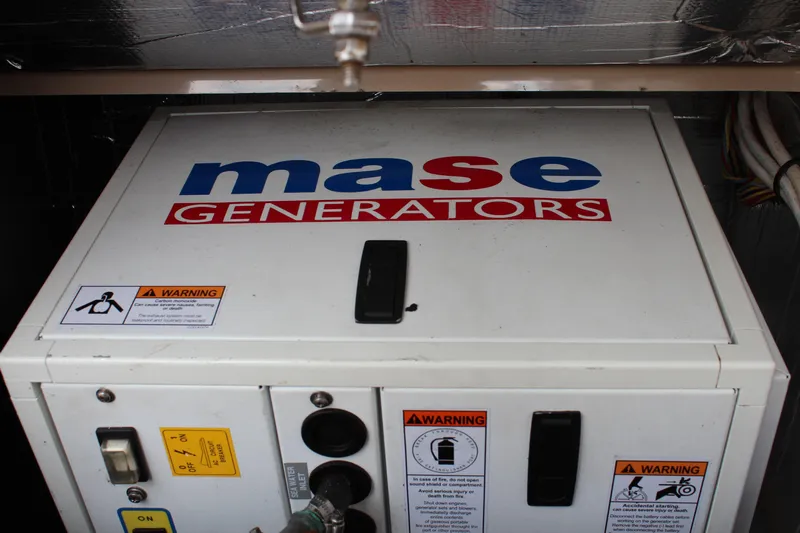 Shake N Bake Yacht Photos Pics Mase generator in a 2013 Cutwater 28 LE boat, featuring safety warnings and controls.