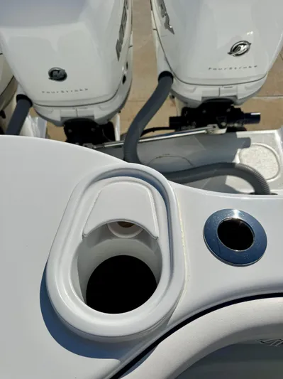  Yacht Photos Pics 2020 Yellowfin 42 Offshore boat with dual outboard engines and cup holder detail.