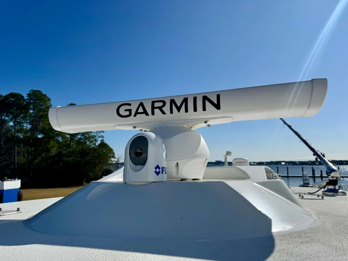  Yacht Photos Pics Garmin radar on 2020 Yellowfin 42 Offshore boat, clear sky background.