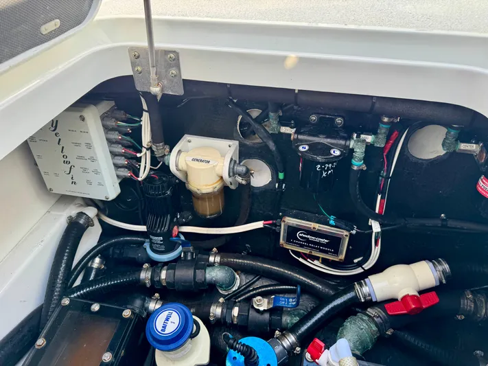 Yacht Photos Pics Engine compartment of a 2020 Yellowfin 42 Offshore boat, showcasing various mechanical components.
