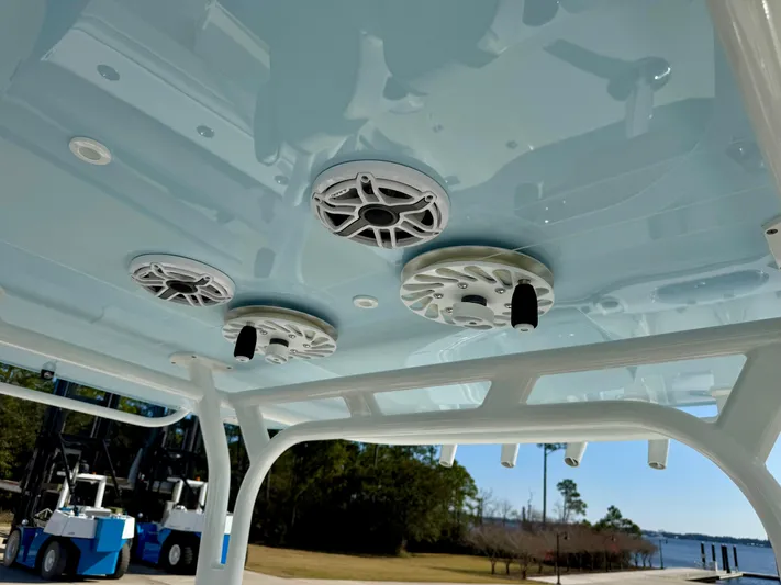  Yacht Photos Pics 2020 Yellowfin 42 Offshore boat speakers on light blue ceiling, dockside view.