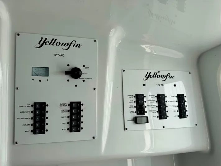  Yacht Photos Pics Control panels on a 2020 Yellowfin 42 Offshore boat, featuring 120VAC and 12VDC systems.