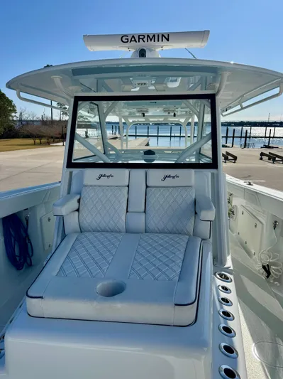  Yacht Photos Pics 2020 Yellowfin 42 Offshore boat with Garmin equipment, docked near a waterfront.