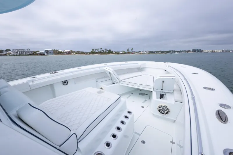  Yacht Photos Pics 2020 Yellowfin 42 Offshore boat interior with seating, on calm water.