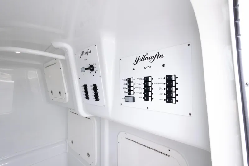  Yacht Photos Pics Control panel inside 2020 Yellowfin 42 Offshore boat, featuring labeled switches and circuits.