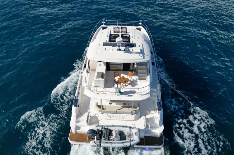  Yacht Photos Pics Aquila 54 Yacht 2025 cruising on open sea, aerial view.