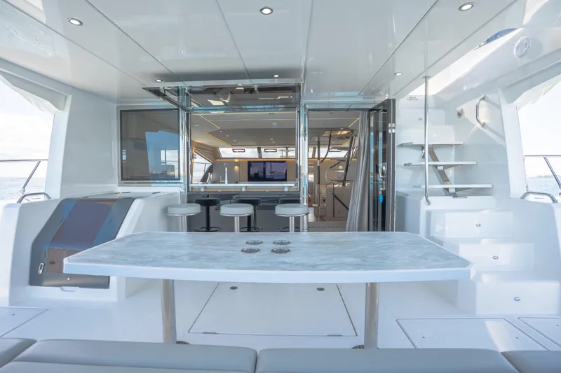  Yacht Photos Pics Luxurious interior of 2025 Aquila 54 Yacht with modern seating and sleek design.