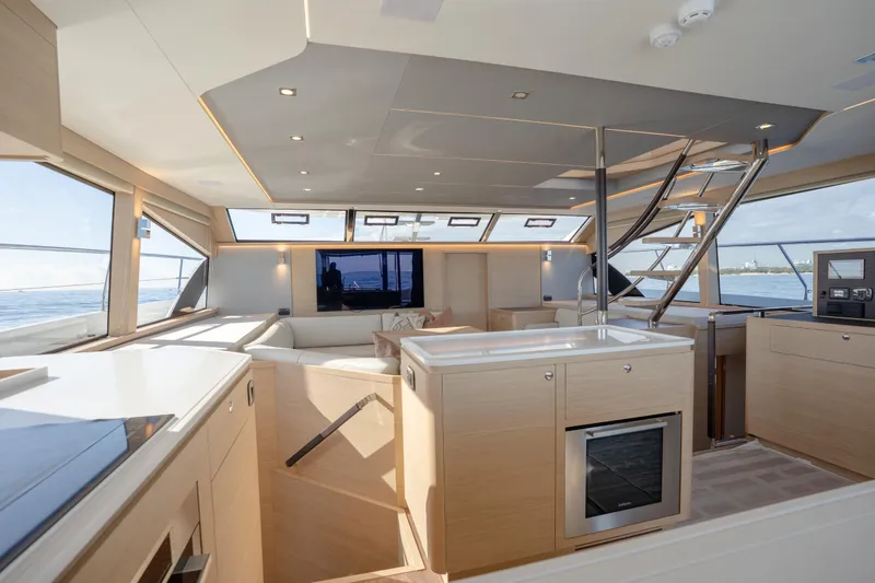  Yacht Photos Pics Luxurious interior of 2025 Aquila 54 Yacht with modern design and panoramic windows.