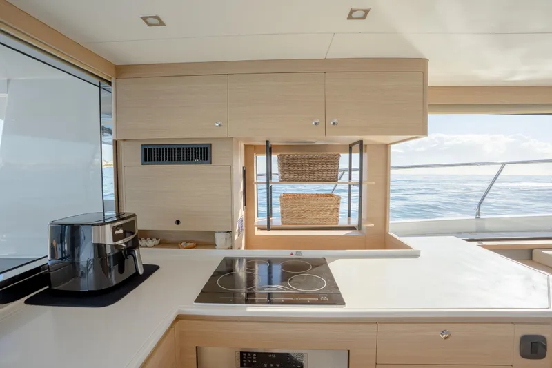  Yacht Photos Pics Modern kitchen interior on 2025 Aquila 54 Yacht with ocean view.