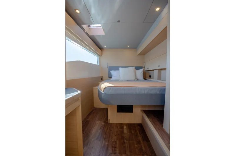  Yacht Photos Pics Luxurious cabin interior of 2025 Aquila 54 Yacht with modern design and cozy bedding.