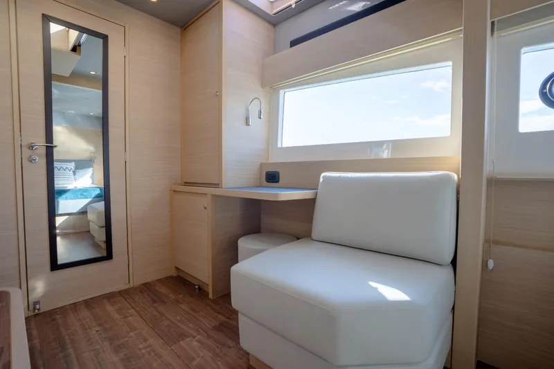  Yacht Photos Pics Luxurious interior of 2025 Aquila 54 Yacht with modern seating and natural light.