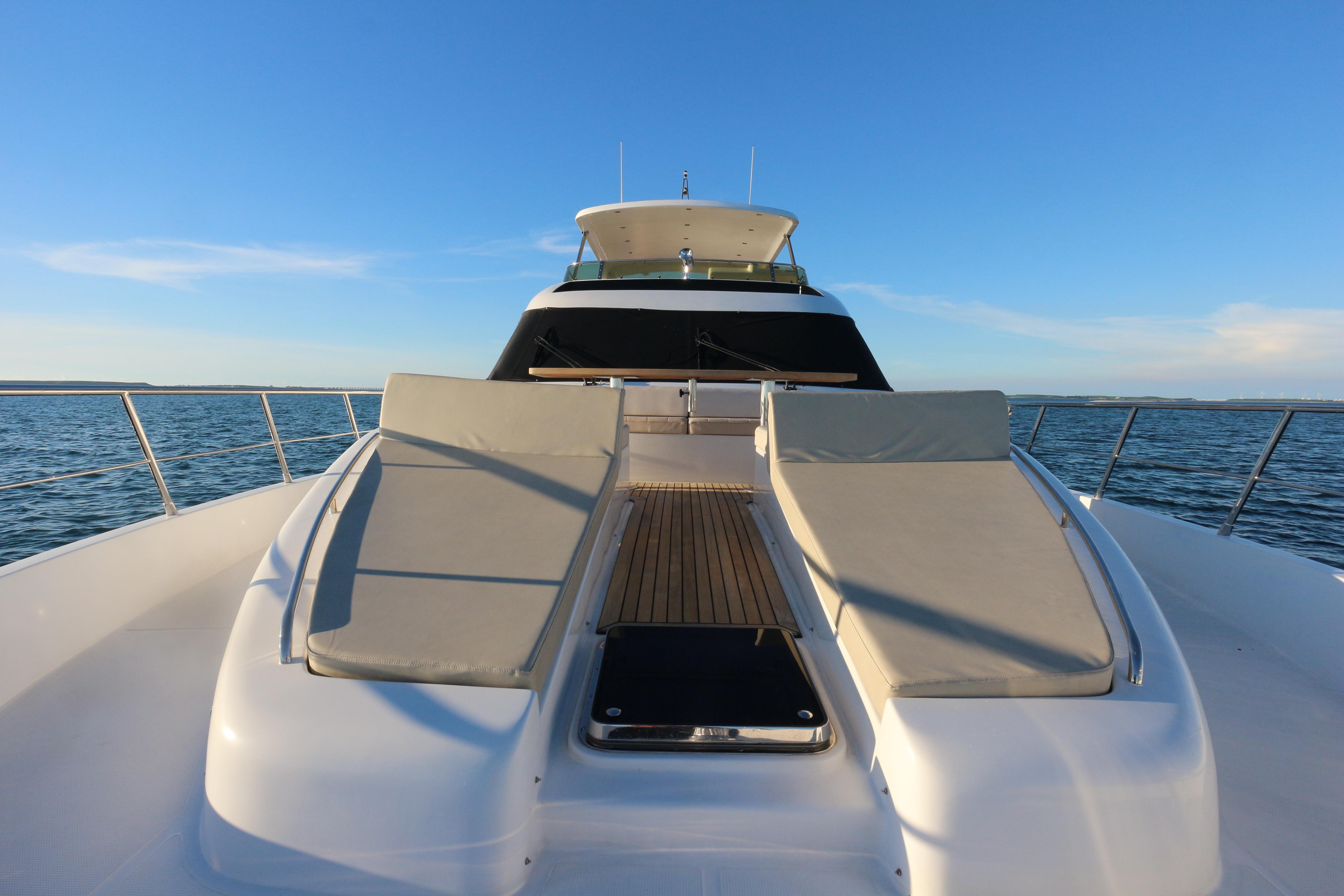 Luxurious Ruby 72 yacht deck with sun loungers, 2019 model, on open sea.