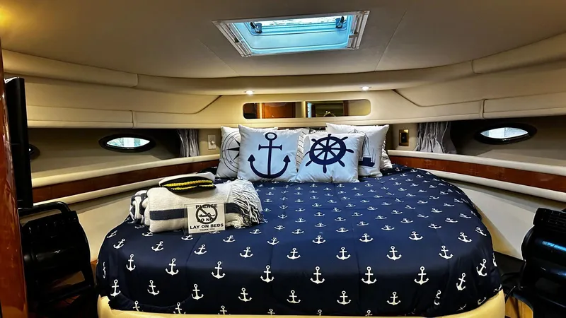 Sea Me Yacht Photos Pics Luxurious 2000 Sea Ray 460 Sundancer cabin with nautical-themed bedding and decor.