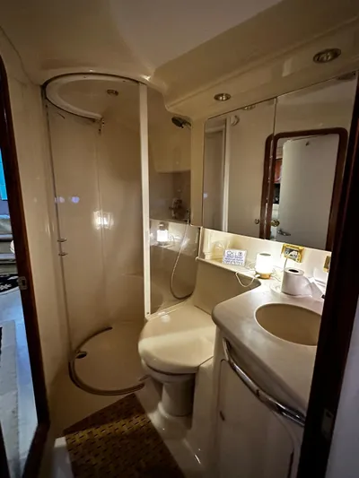Sea Me Yacht Photos Pics Luxurious bathroom in 2000 Sea Ray 460 Sundancer yacht with shower and vanity.