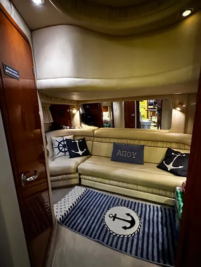 Sea Me Yacht Photos Pics Luxurious interior of 2000 Sea Ray 460 Sundancer yacht with nautical decor.
